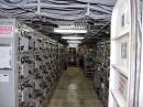 Looking into the Iowa's transmitter room: Exciter/power amplifier units are on the right, while antenna couplers are in the left-hand racks.